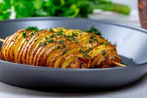 Baked potatoes with herbs on a baking sheet